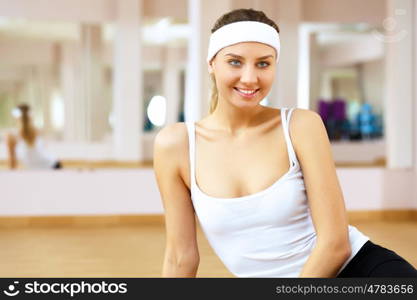 Young woman in sport wear doing sport in gym