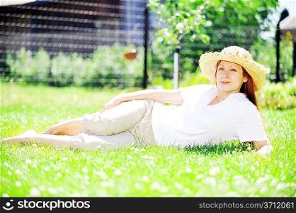 young woman in straw hat relaxing outdoor