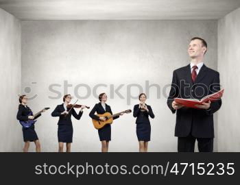 Young woman in suit playing different music instruments. One man band