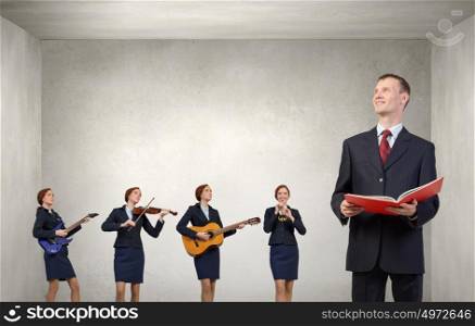 Young woman in suit playing different music instruments. One man band