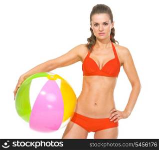 Young woman in swimsuit with beach ball
