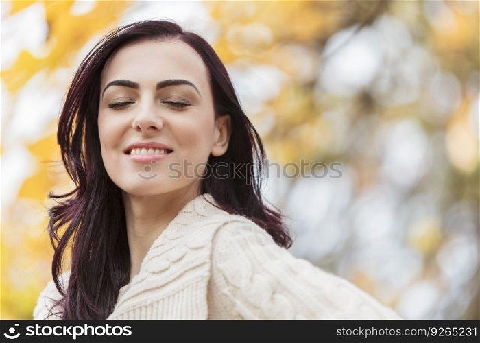 Young woman in the autumn forest
