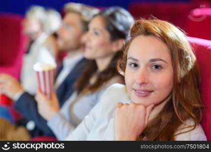 young woman in the cinema on comedy