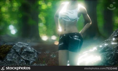 young woman in torn t-shirt in green forest