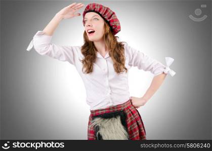 Young woman in traditional scottish clothing
