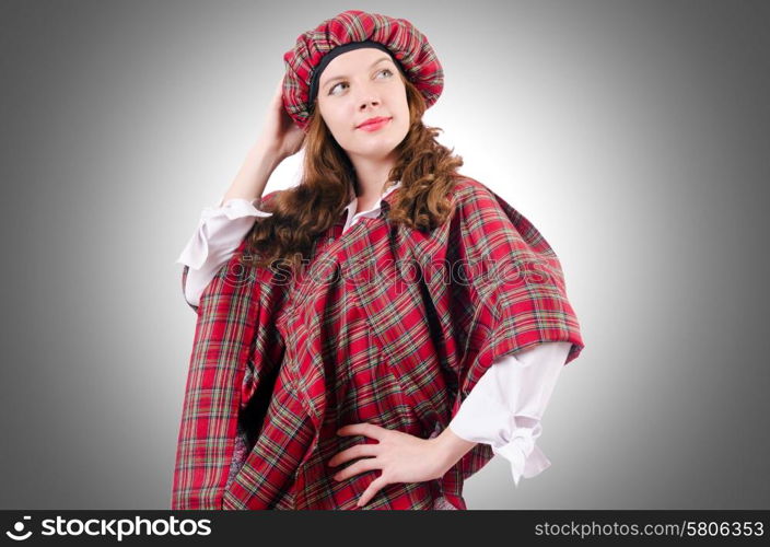 Young woman in traditional scottish clothing