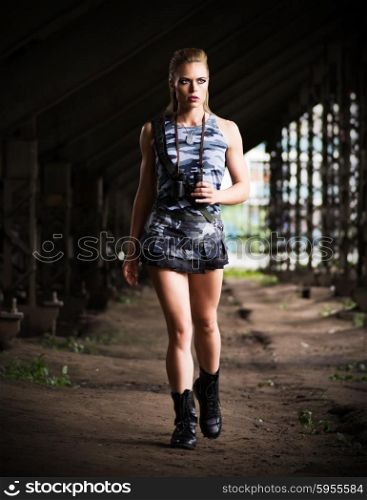 Young woman in uniform with binoculars (dark version)