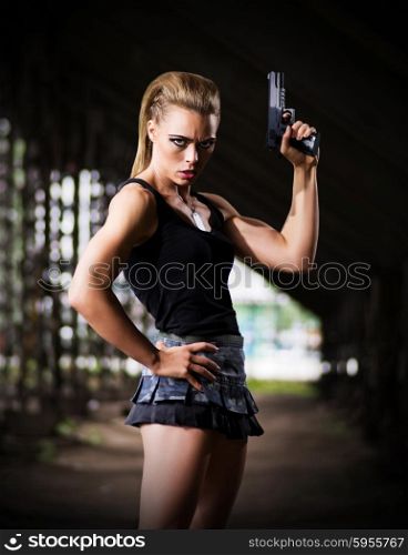 Young woman in uniform with gun (dark version)
