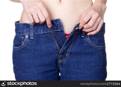 young woman in unzipped jeans