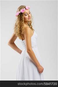 Young woman in wedding dress isolated