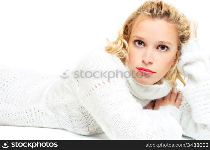 young woman in white sweater lying on the floor