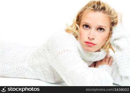 young woman in white sweater lying on the floor