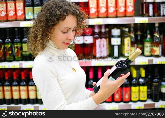 Young woman in wine shop