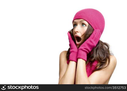 young woman in winter accessories looking very surprised