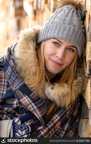 Young woman in winter jacket cover blanket portrait countryside