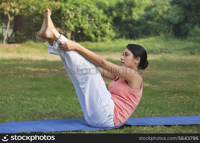 Young woman in yoga position