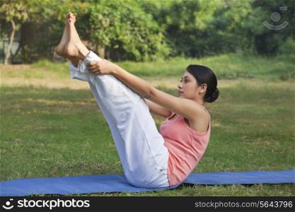 Young woman in yoga position