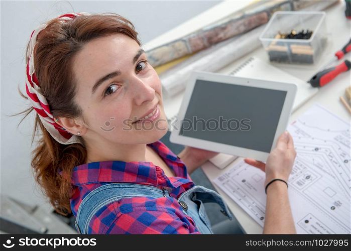 young woman interior designer using a digital tablet