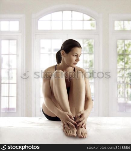 Young woman is resting after the yoga exercise.
