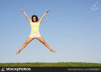 Young woman jumping in air