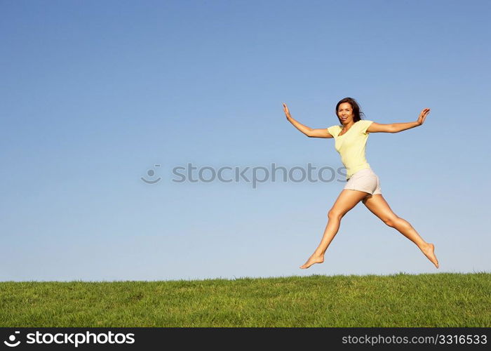 Young woman jumping in air