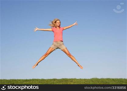 Young woman jumping in air