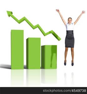 Young woman jumping up against financial charts