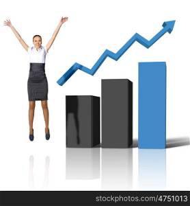 Young woman jumping up against financial charts
