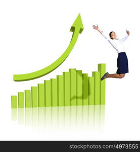 Young woman jumping up against financial charts