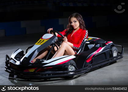 Young woman karting racer isolated