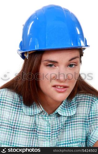 Young woman laborer grimacing