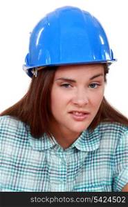 Young woman laborer grimacing