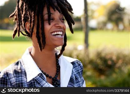 Young woman laughing. Horizontally framed shot.