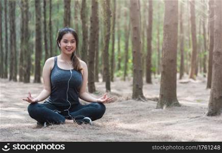 Young woman lifestyle relax sitting meditation yoga in morning at forest nature