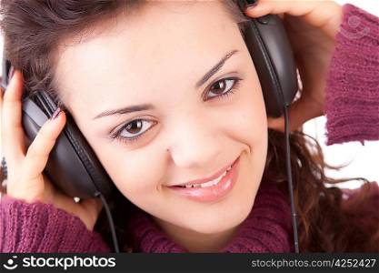 Young woman listening to music - isolated