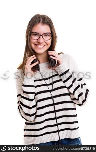 Young woman listening to music, isolated over white