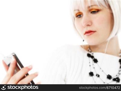 Young woman listening to music on an MP3 player