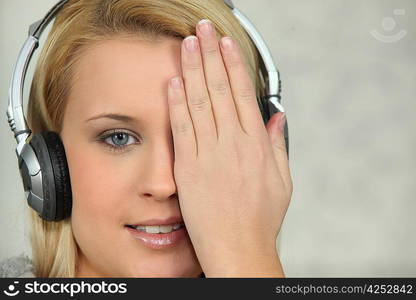 Young woman listening to music with headphones