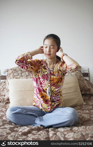 Young woman listening to music with her eyes closed