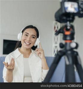 young woman live streaming from home