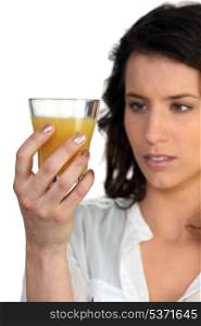 young woman looking at juice