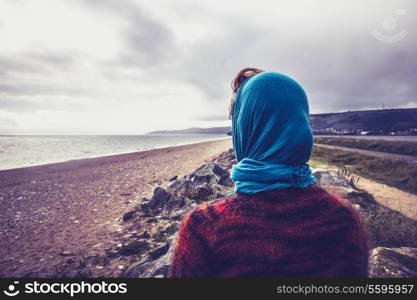 Young woman looking at the sea