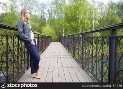 Young Woman Looking Forward From The Bridge