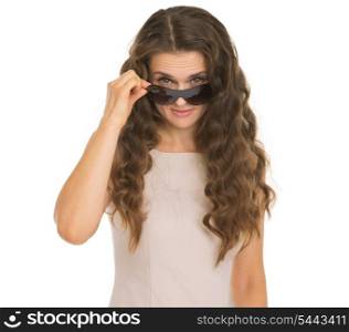 Young woman looking from sunglasses
