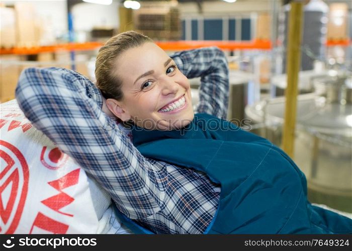 young woman looking happy on the factory