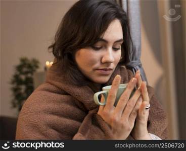 young woman looking her cup coffee