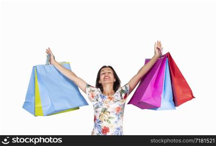 young woman looking up with shopping bags on white background