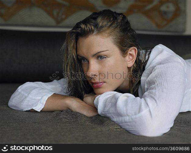 Young Woman Lying on Bed