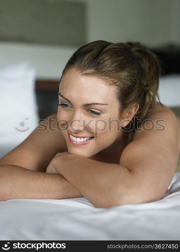 Young Woman Lying on Bed