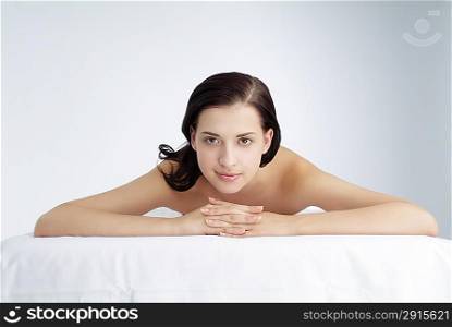Young woman lying on front